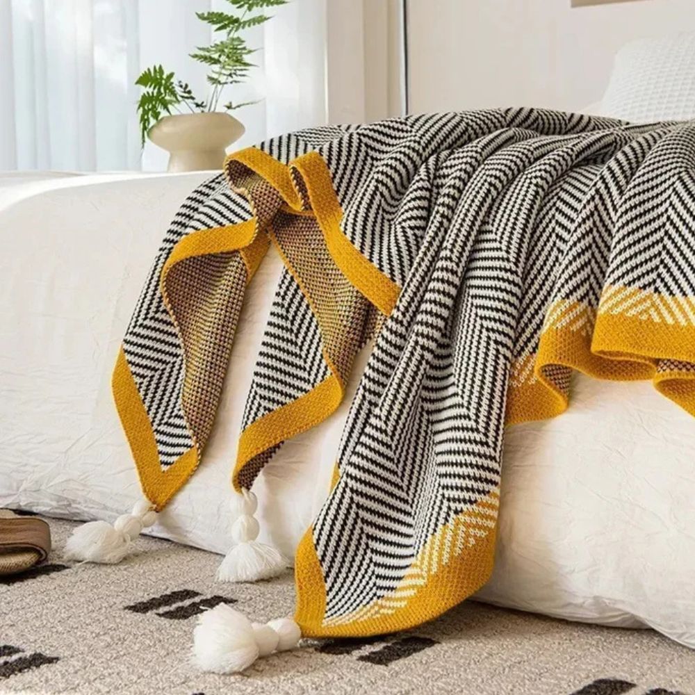 Luxe deken met gouden zigzagpatroon